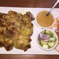 Chicken Satays · Chicken skewers marinated in herbs, spices, yellow curry powder. Served with peanut sauce an...