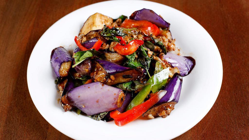 Pad Eggplant · Sautéed protein in black bean sauce with eggplant, bell pepper and basil.