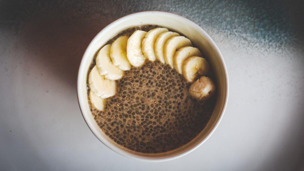 Banana Chia Pudding · Creamy chia seed pudding made with coconut almond milk and lightly sweetened with coconut sugar. Topped with organic bananas.