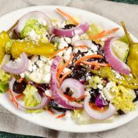 Greek Salad (Half) · Carrots, red cabbage, cucumber, kalamata olives, red onions on a bed of romaine lettuce, all...