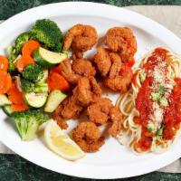 Prawns · Six pieces lightly breaded or sautéed prawns with vegetables and pasta.