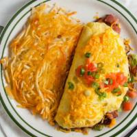 Meat Lovers Omelet · Diced ham, bacon, sausage, onions, mushrooms, and bell peppers topped with shredded cheddar ...