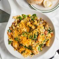 Veggie Skillet · Fresh mushrooms, spinach, tomatoes & zucchini scrambled into two fresh eggs, topped with che...