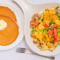 The Farmers Scramble · Diced ham, scrambled eggs, bell pepper, onion, potatoes and cheddar cheese. Topped with toma...