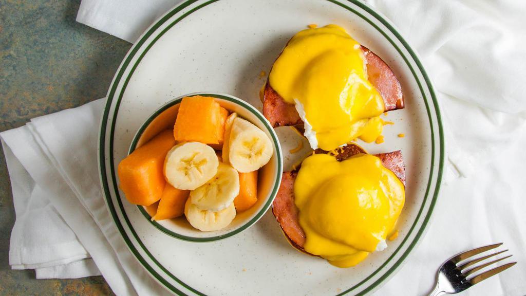 Eggs Benedict · Two poached eggs over  sliced ham on a grilled English muffin and topped with hollandaise sauce. 530-1078 cal.