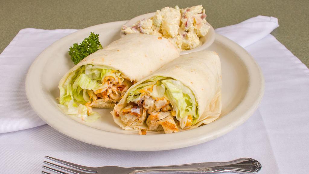 BBQ Chicken Wrap · Crispy or grilled chicken, bacon, jack cheese, tomatoes, and lettuce mixed with ranch and BBQ sauce in a flour tortilla. 1142-1406 cal.