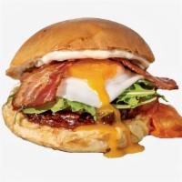 Deluxe Smashed Sammy · Breakfast sandwich with cheddar and Swiss cheese, fried egg, and your choice of meat/veggie.