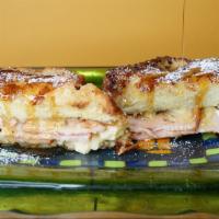 The Monte Cristo · This elegant sandwich reigns. Swiss cheese, ham , mustard, mayo all in a french toast. YUM!