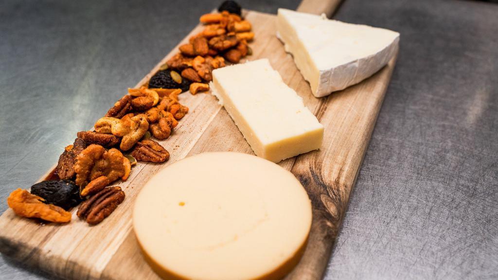Artisanal Cheese Board · 3 rotating cheeses.