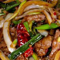 *Wok-Seared Mongolian (蒙古肉) · Tender flank steak beef wok-seared with grilled onion, garlic, dried chili, jalapeño and sca...