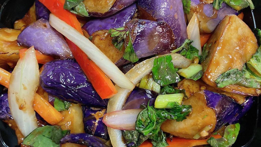 *Eggplant w. Fresh Basil (炒茄子) · Eggplant wok-seared with fresh basil, garlic, hoisin sauce, sweet red peppers, jalapeño, and onion. Spicy.