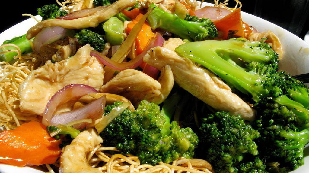 Hong Kong Crispy Noodles (煎面) · Fresh broccoli, carrots, and mushrooms sautéed in a signature brown sauce over a bed of crispy pan-fried noodles (packed separately). Protein options available.