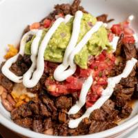 CARNE ASADA BURRITO BOWL * · A burrito bowl served with our carne asada, rice, pinto beans, guacamole, pico de gallo, & s...