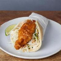BAJA TACO * · Beer battered fish in soft corn tortillas with cilantro, cabbage, red onions, roasted tomato...