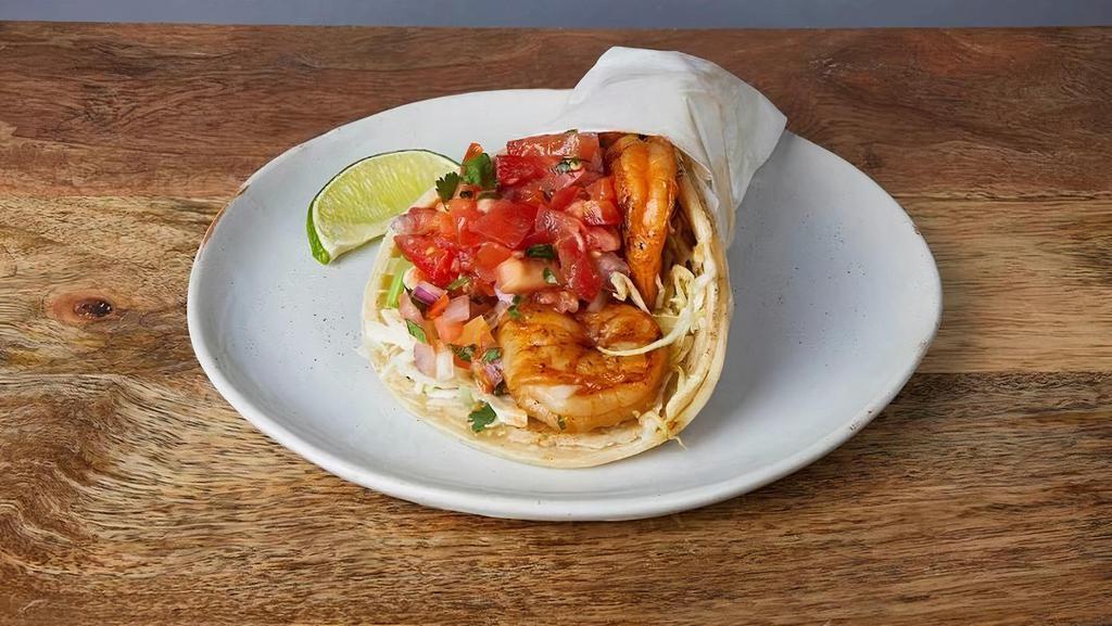 SHRIMP TACO * · Marinated shrimp in soft corn tortillas with cilantro, cabbage, red onions, pico de gallo, & tomatillo salsa