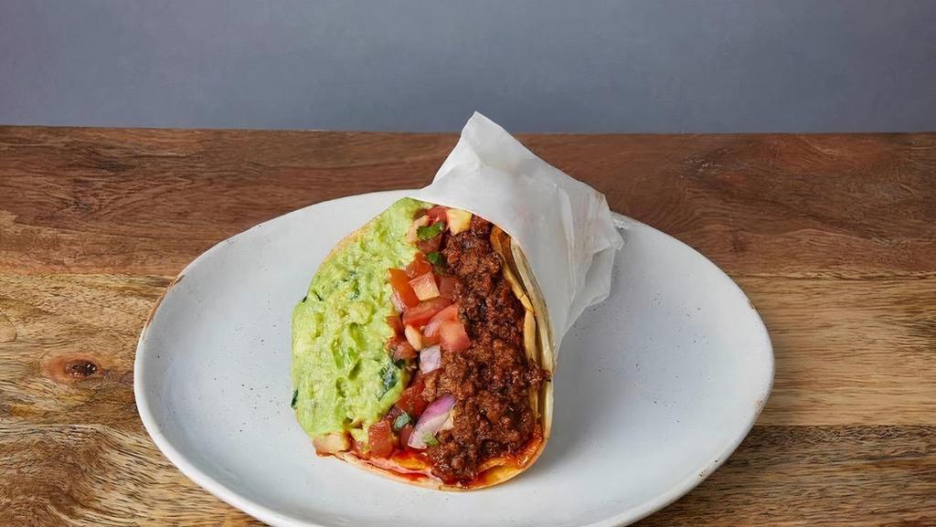 CRISPY CHORIZO * · One taco with a grilled crispy corn tortilla wrapped in a soft corn tortilla. With Jack cheese, pinto beans, pico de gallo, & guacamole