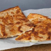 'POCO QUESO' QUESADILLA * · Just a crispy wheat tortilla with melted Jack cheese
