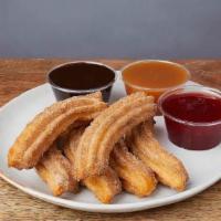 CHURROS * · Classic Mexican churros with chocolate, caramel, or strawberry sauce