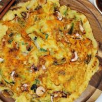 Seafood Pancake · A mixture of seafood and green onion pan fried in pancake batter.