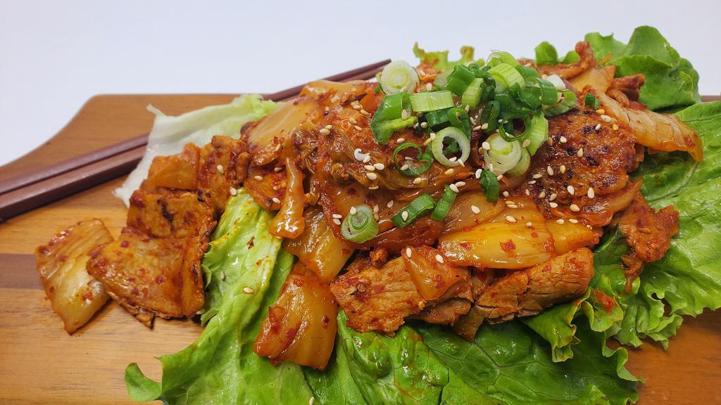 Kimchi Pork Belly · Stir fried pork belly and kimchi with rice.