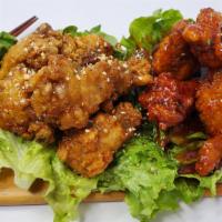 Half Soy Garlic and Spicy Wings · Deep fried chicken wings half glazed with soy garlic sauce and half with spicy sauce.