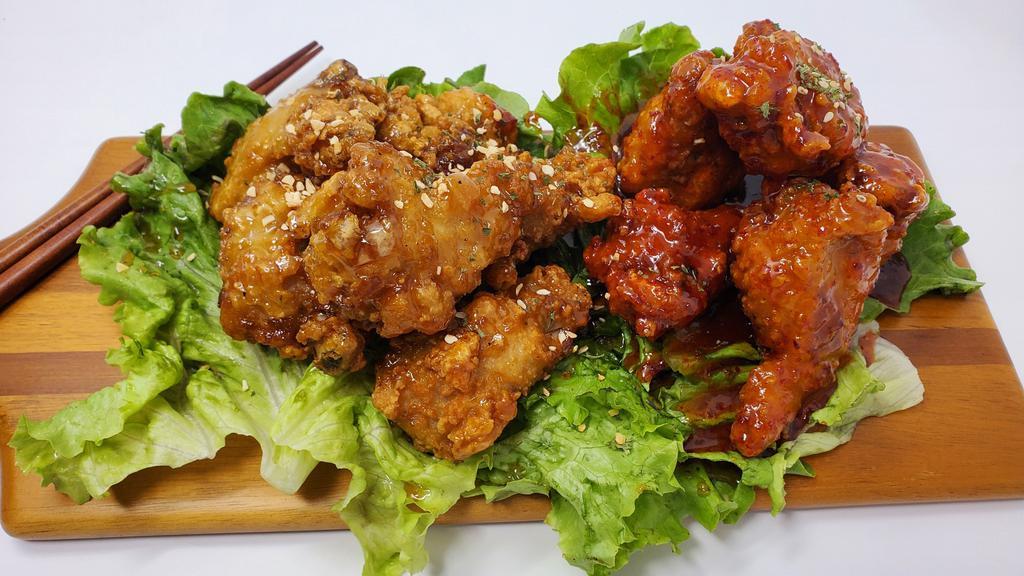 Half Soy Garlic and Spicy Wings · Deep fried chicken wings half glazed with soy garlic sauce and half with spicy sauce.