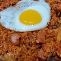 Kimchi Fried Rice · Rice fried with kimchi topped with a fried egg.
