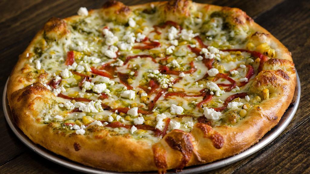 Corn · 18 inch pizza with pesto, roasted bell pepper and goat cheese.