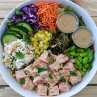 Spicy Tuna Poke Bowl · Spicy Tuna Poke served over rice & mixed greens with krab salad, seaweed salad, cucumber, co...