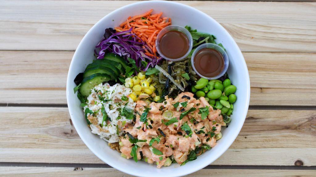 Spicy Shrimp Poke Bowl · Spicy Shrimp served over rice & mixed greens with krab salad, seaweed salad, cucumber, corn, carrot, red cabbage, edamame, crispy onion, furikake and cilantro.