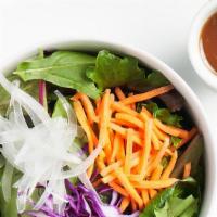 Mixed Green Salad [V] · [V.GF] Organic mixed greens, carrot, onion & red cabbage w/ house-made oil-free dressing
