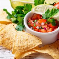 Vegetarian Nachos · Delicious Nacho chips topped with beans, cheese, sour cream, avocados, lettuce, tomato, and ...