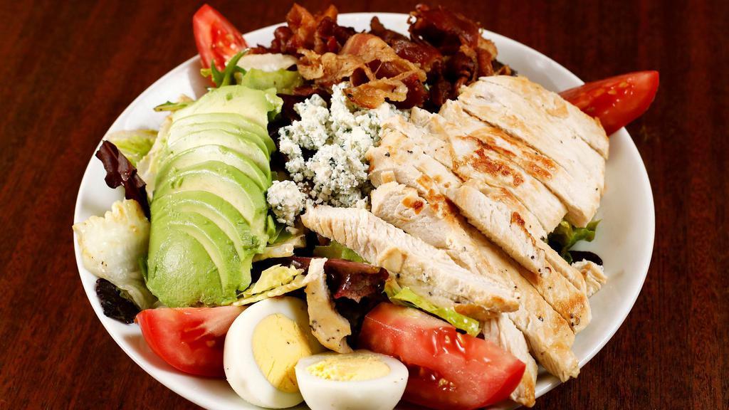 Cobb Chicken Salad · Baby green mix, grilled chicken, bacon, egg, avocado, crumbled blue cheese and tomato with your choice of dressing.