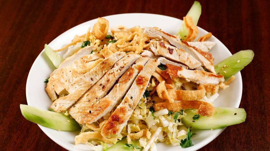 Chinese Chicken Salad · Shredded lettuce and napa cabbage, grilled chicken, cilantro, sesame seeds, cucumbers and wontons with ginger sesame dressing.