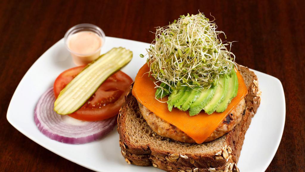 Sunshine Salmon · Avocado, sprouts, cheddar, and tomato on whole wheat toast.