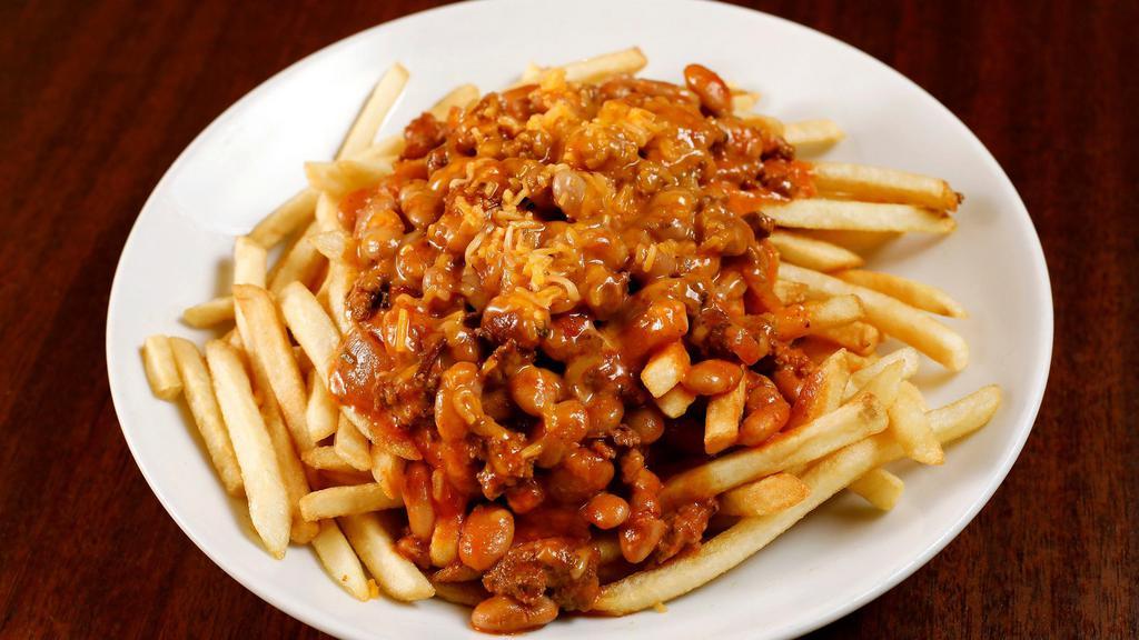 Chili Cheese Fries · Our housemade beef chili topped with cheddar cheese and chopped onion on the side.