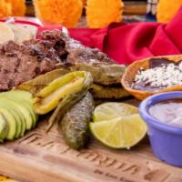 Arrachera · Squirt steak, cactus, chorizo, refried beans, cambray onions, roasted jalapeño, and handmade...