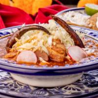 Pozole · Pork, hominy, onions, cabbage, radish, and tostadas with sour cream and fresh cheese.