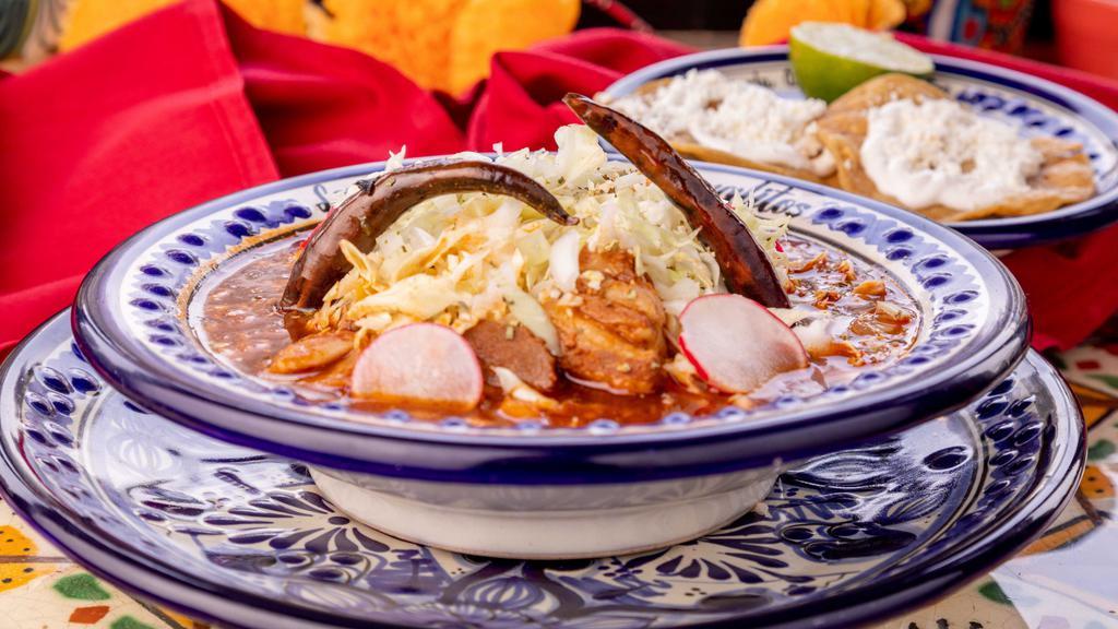 Pozole · Pork, hominy, onions, cabbage, radish, and tostadas with sour cream and fresh cheese.