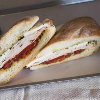 Basil Turkey Special · Turkey, fresh mozzarella, sweet bell peppers, sun-dried tomatoes, and basil spread.