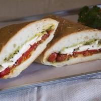 Joe Special · Fresh mozzarella, sweet bell peppers, sun-dried tomatoes, and basil spread.