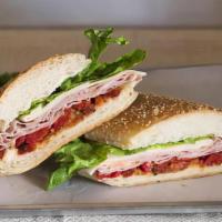 Lucca Special · Mortadella, provolone, sweet bell peppers, sun dried tomatoes, and lettuce.