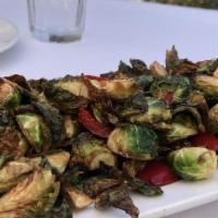 Crispy Brussels Sprouts · Fried Brussel sprouts and red bell peppers tossed in a soy
glaze