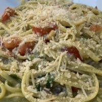 Pesto Linguini · Al dente linguine served with fresh house made pesto sauce, vine-ripened tomatoes and topped...
