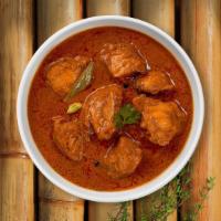 Chicken Vindaloo In Vain · Boneless chicken with potatoes cooked in a hot spicy curry.
