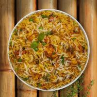 Vegetable Biryani · Fragrant rice cooked with fresh garden vegetables and nuts.