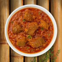 Lamb Tikka Masala · Diced tandoori lamb cooked in creamy sauce with tomatoes and spices.