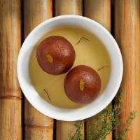 Gulab Jamun · Juicy milk balls dipped in honey syrup with a touch of rose water.