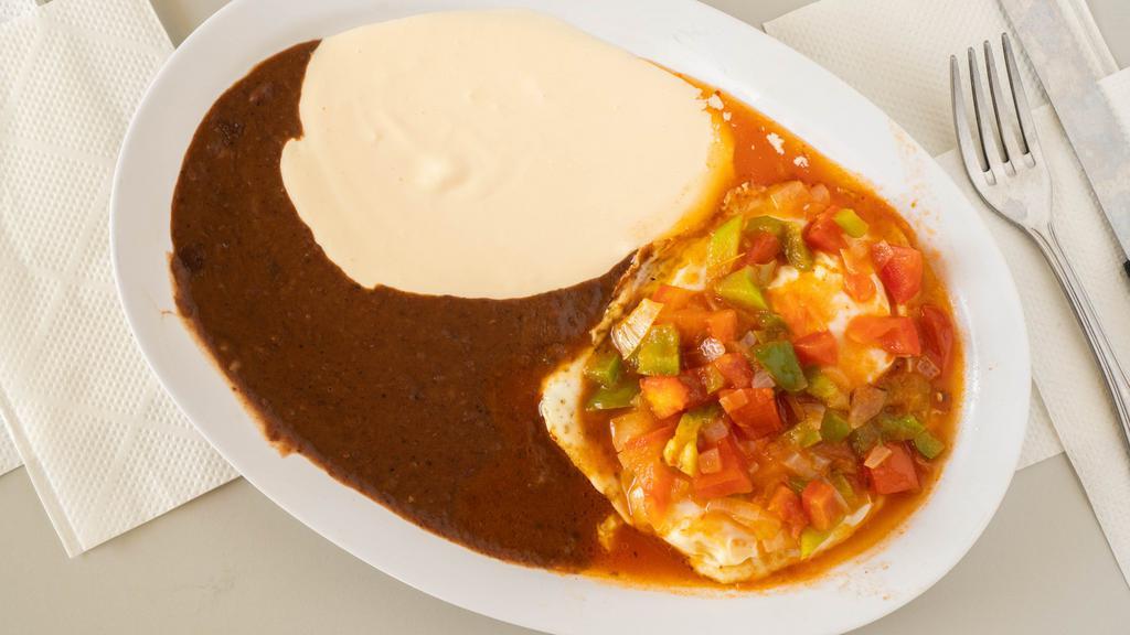 Rancheros Eggs/Desayuno Ranchero · Huevos rancheros ,con frijoles y crema / Rancheros Eggs with, beans , and sour cream.