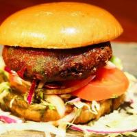 the Masala Burger* · Housemade veggie patty in a bun with lettuce, cheese & sauces